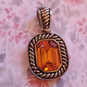 Beautiful topaz enhancer rhodium silver finish.  Does NOT tarnish